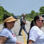 Protesters outside the site for a new proposed detention center in FL